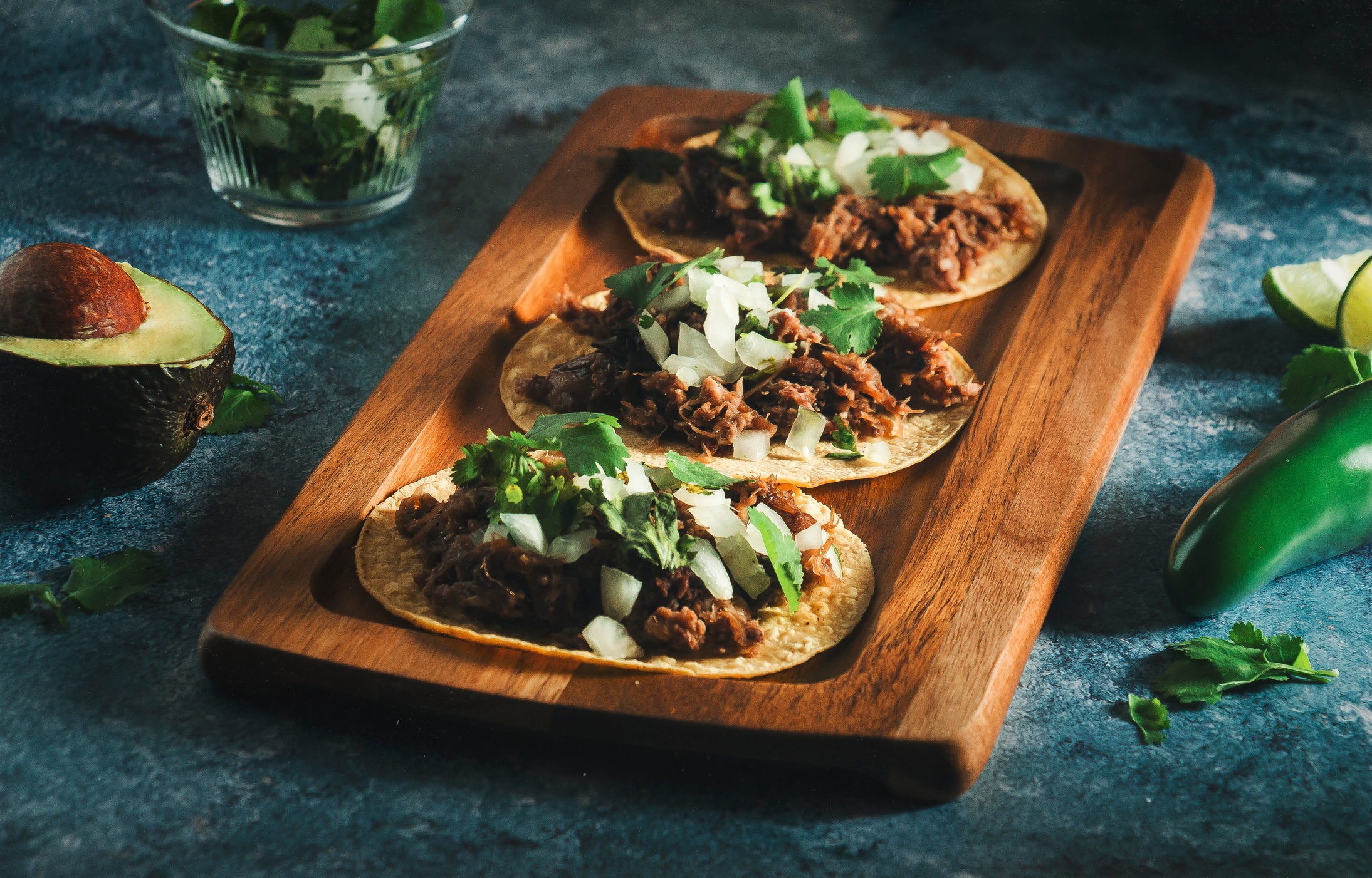 Tacos of Barbecue in Wood Tray on Blue Background